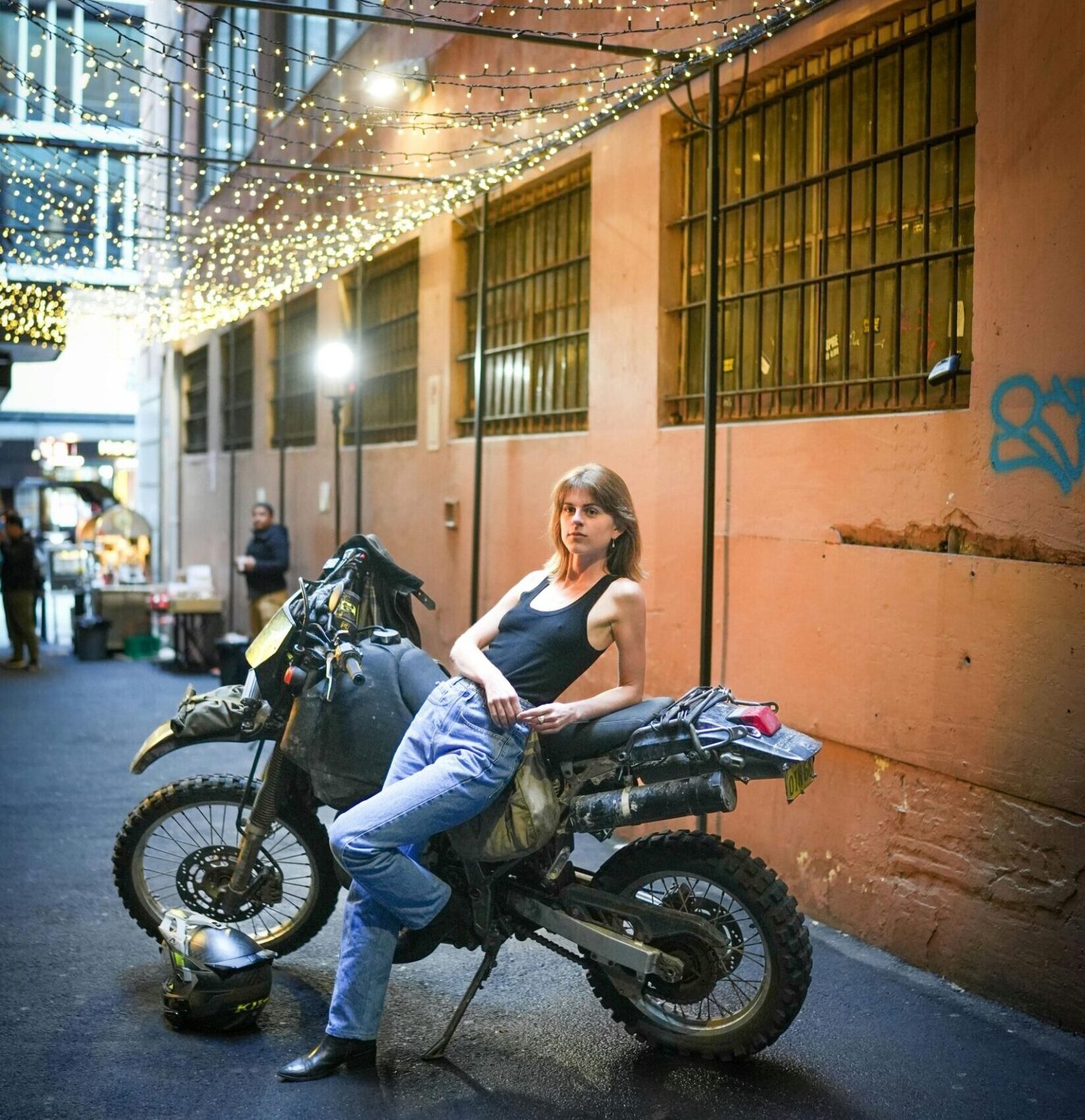 Women standing next to motorcycle